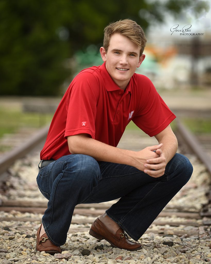 senior boy on tracks